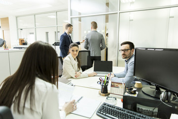 Group of young business people working at office