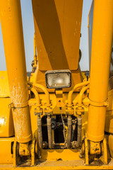 yellow backhoe loader on construction site and work