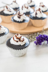 chocolate cup cake with whipped cream