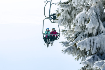 Fototapeta na wymiar Chairlift in a small ski resort.