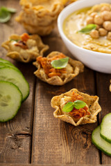 Homemade hummus in tortilla bowls