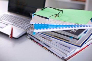 Group of multicolored office folders and glasses