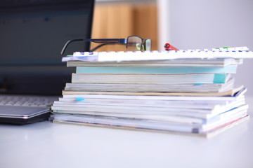 Group of multicolored office folders and glasses