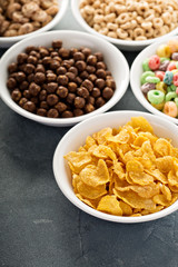 Variety of cold cereals in white bowls