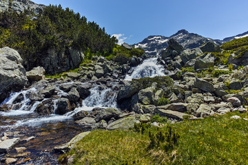 Fototapeta na wymiar Waterfall and Sivrya peak, Pirin Mountain, Bulgaria