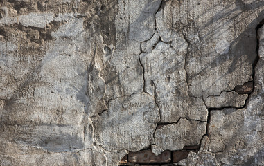Old brick wall.Rough cracked plaster.Copy Space.Gray background old brick wall