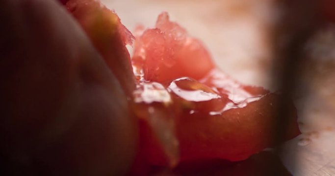 Tomato slicing slowmotion close up