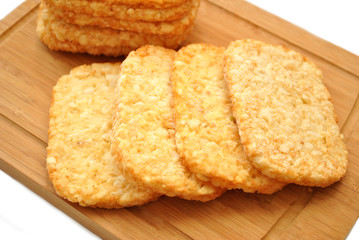Frozen Potato Hash Browns on a Wooden Cutting Board