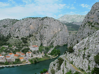 Fototapeta na wymiar Cliffs by the river ina small city in Croatia