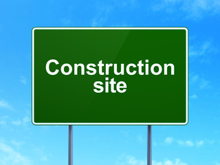 Building construction concept: Construction Site on road sign background