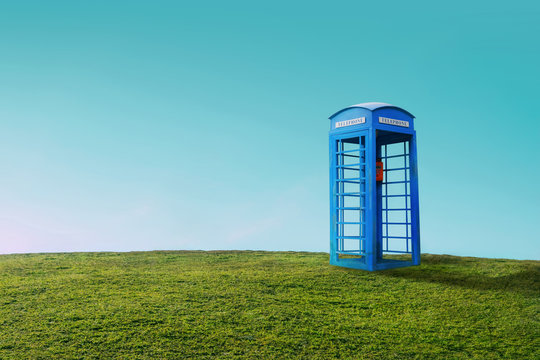 Phone booth on a hill, the concept of communication without boundaries.