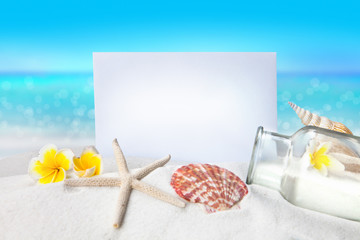Fototapeta na wymiar Paper, Shells on sandy beach, Summer concept