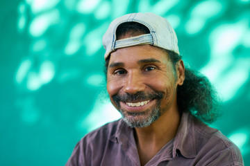 Smiling People Portrait Of Hispanic Man With Goatee Laughing