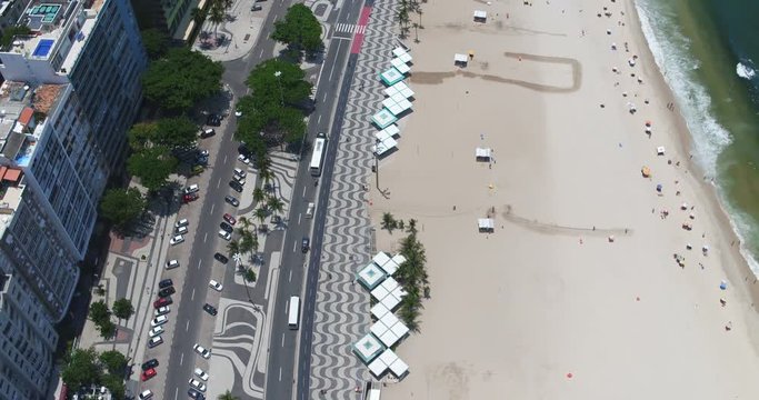 Flying above Copacabana Beach iconic sidewalk and the beach, Rio de Janeiro, Brazil