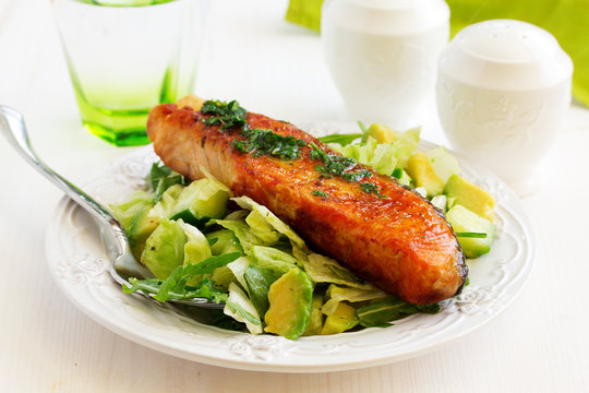 Fresh Grilled Salmon With A Salad Of Avocado.