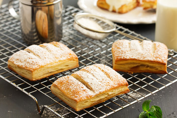 Homemade cakes and puff pastry with apples and caramel.