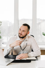 businessman in white shirt at the desk,