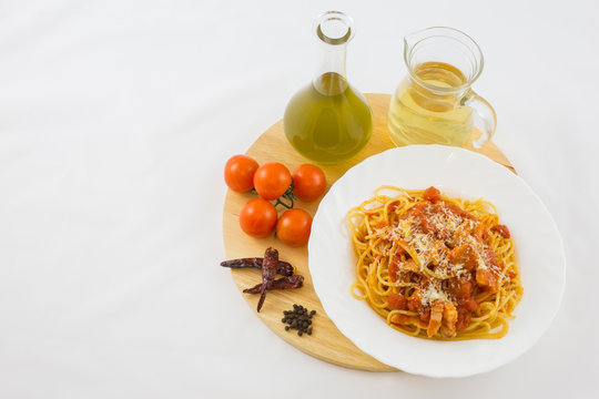Amatriciana Pasta with its ingredients.