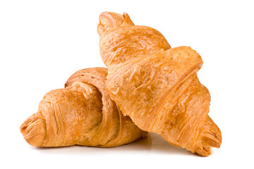 two croissant isolated over a white background closeup
