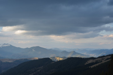 Fototapeta na wymiar Mountain landscape with cloudy sky