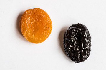 prunes and dried apricots on a white background