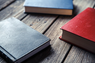 Top view on the pile of books lying on the table