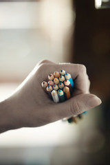 Hand with pencils