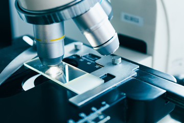 Modern microscope in the laboratory. Closeup shot.