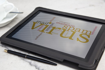 tablet with computer virus word cloud