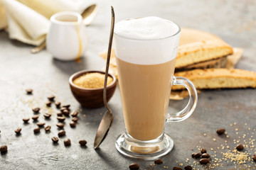 Hot coffee latte with biscotti cookies