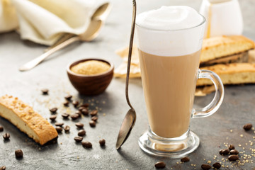 Hot coffee latte with biscotti cookies
