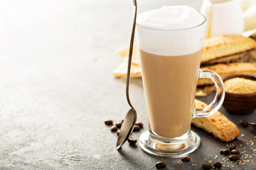 Hot coffee latte with biscotti cookies