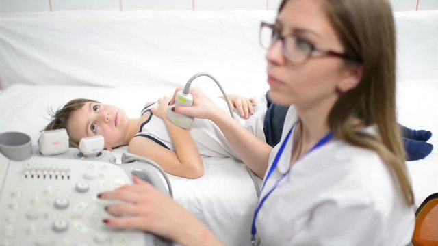 Cute Boy Being Diagnosed at Ultrasound Device in a hospital