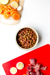 Set of animal food, meat,vegetables and eggs on kitchen top view