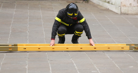 firefighter while assembling the ladder during an emergency