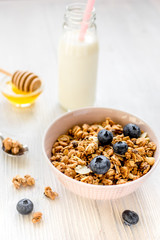 Healthy morning with granola breakfast on white kitchen table
