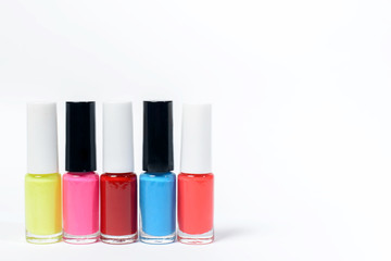 Group of color nail polishes isolated on white