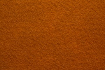 Brown colored felt background.