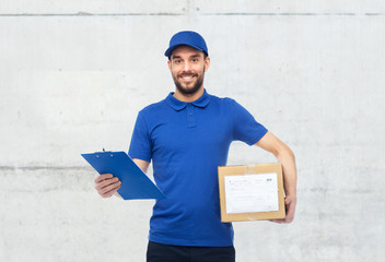 happy delivery man with parcel box and clipboard