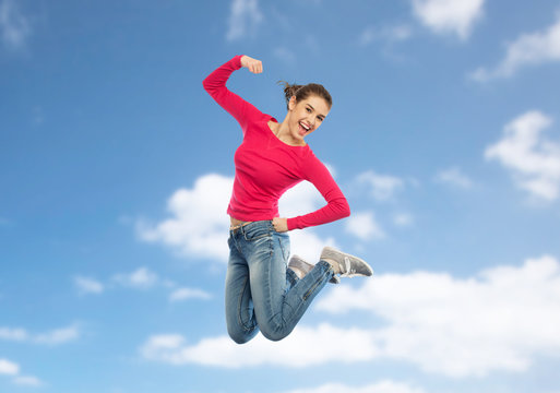 smiling young woman jumping in air