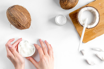 organic cosmetics with coconut on white background top view