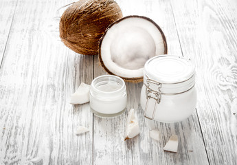 organic cosmetics with coconut on wooden background close up