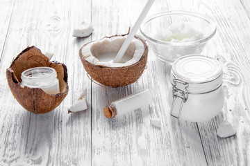 organic cosmetics with coconut on wooden background close up