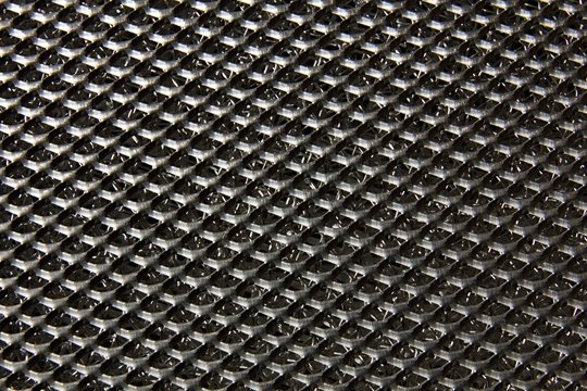 Perforated metal sheet for background.