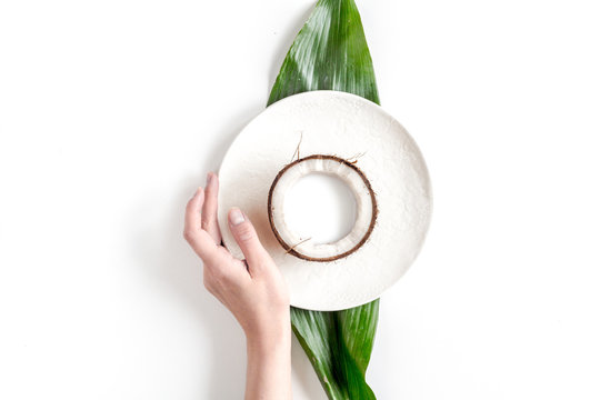 Coconut On Plate Top View On White Background