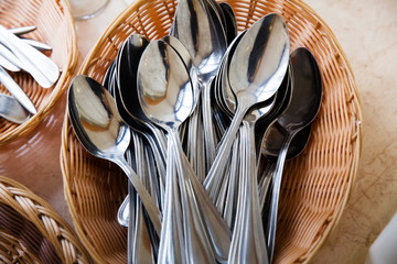 A lot of spoons in the basket