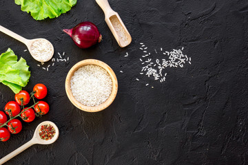 ingredients for paella on dark background top view
