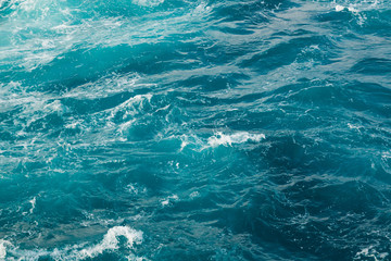 Blue sea water surface in motion with foam © dtatiana