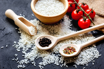 ingredients for paella on dark background