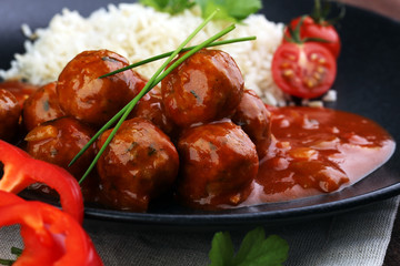Delicious meatballs made from ground beef in a spicy tomato sauce